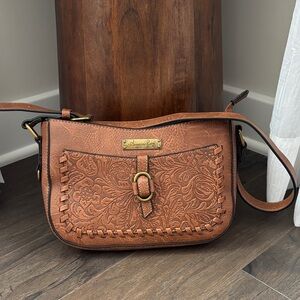 American Rag PU leather embossed
zip top,interior pocket exterior snap pocket